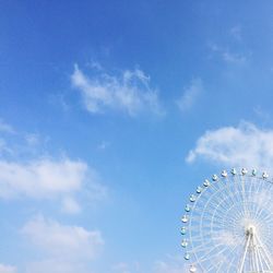 Low angle view of ferris wheel against sky