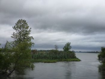 Scenic view of sea against cloudy sky