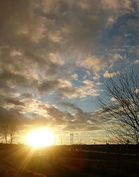 Silhouette landscape against sky during sunset