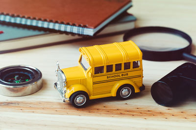 High angle view of toy vehicle on wooden table