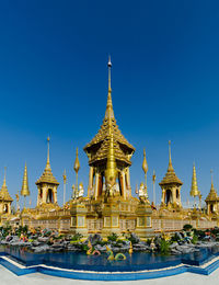 Temple building against clear blue sky