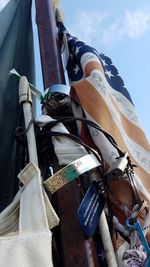 Close-up of clothes hanging against sky