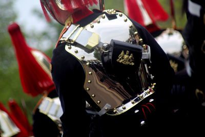 Midsection of army soldier wearing shiny uniform