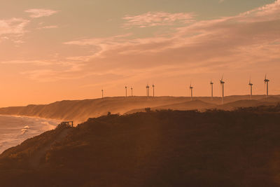 Scenic view of landscape against sky during sunset