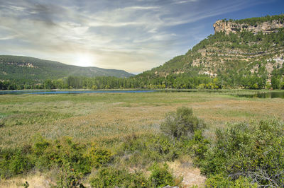 Vegetation, mountains and sun in the unya lagoon, cuenca