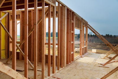 Low angle view of building under construction against sky