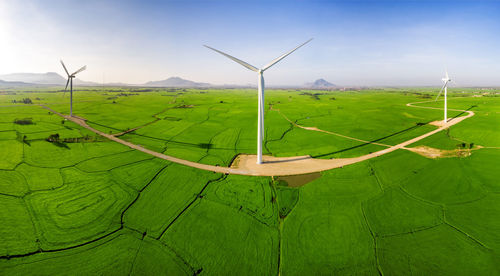 Scenic view of farm against sky