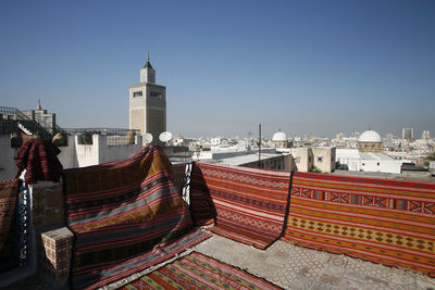 Panoramic view of buildings in city against clear sky