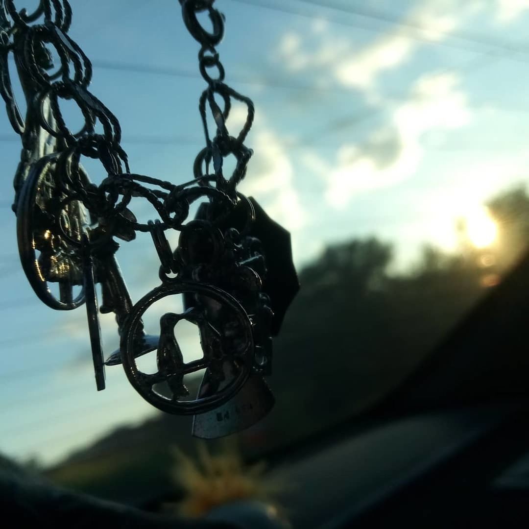 metal, sky, focus on foreground, no people, chain, cloud - sky, close-up, hanging, nature, day, outdoors, protection, connection, low angle view, sunset, security, dusk, safety, sunlight, silhouette