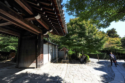 Exterior of building by trees against sky