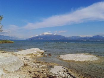 Scenic view of mountains against cloudy sky