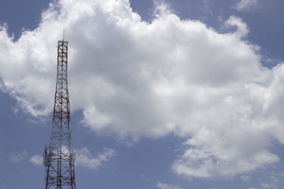 Low angle view of electricity pylon against sky