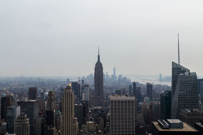 Modern buildings in city against sky