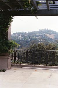 Trees and mountains against sky