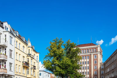 Low angle view of building against clear blue sky