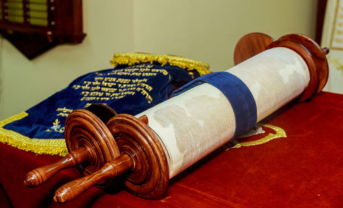 Close-up of torah scroll on table