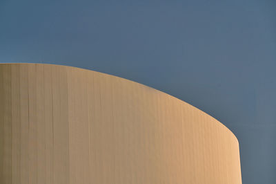 Low angle view of built structure against clear blue sky