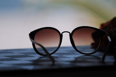 Close-up of sunglasses on table