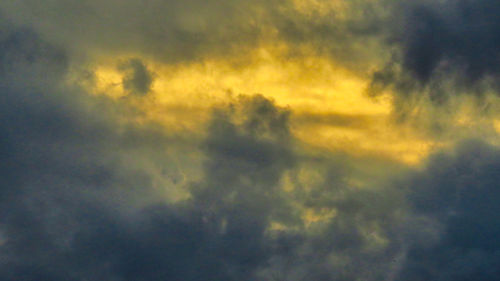 Low angle view of dramatic sky during sunset