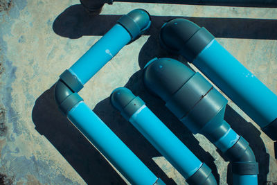 High angle view of blue pipe on wall