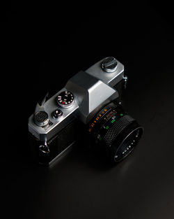 High angle view of camera against black background