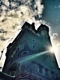 Low angle view of church against cloudy sky