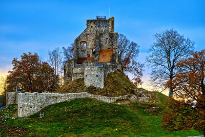 Low angle view of old building against sky