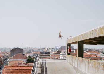 View of buildings in city against clear sky