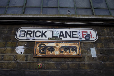 Low angle view of text on wall