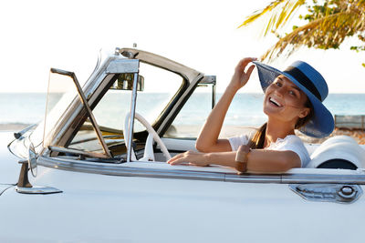 Portrait of smiling young woman in boat