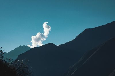 Low angle view of silhouette mountain against sky