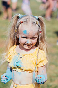 Portrait of happy litttle girl on holi color festival. cute preschooler girl on holi color festival