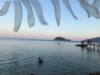 Scenic view of sea against sky at sunset