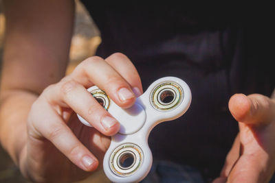 Midsection of person holding camera