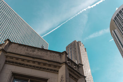 Low angle view of buildings against blue sky