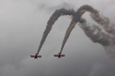 Low angle view of airplane flying in sky