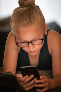 Midsection of woman using mobile phone
