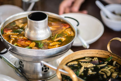 High angle view of person having food on table