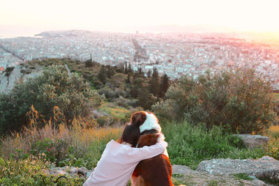 Rear view of couple on landscape against mountain