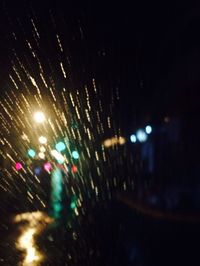 View of illuminated road at night