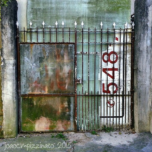 closed, built structure, building exterior, architecture, door, safety, protection, security, text, metal, wall - building feature, communication, gate, weathered, western script, graffiti, entrance, day, outdoors, fence