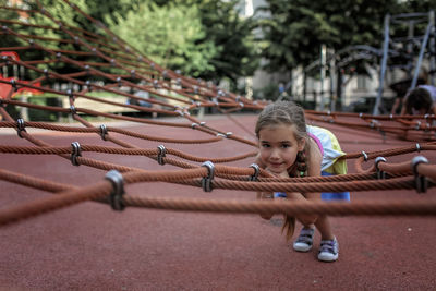 Portrait of girl playing in playground