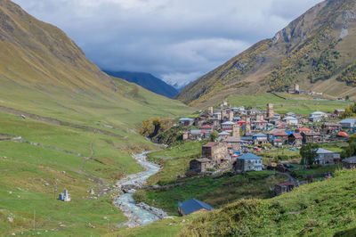 Scenic view of landscape and mountains against sky