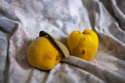 High angle view of yellow fruit on bed