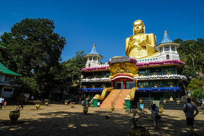 Statue of temple against sky