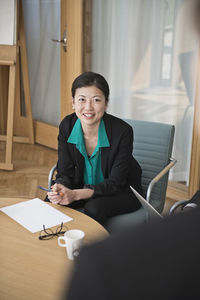Mid adult woman in conference room, stockholm, sweden
