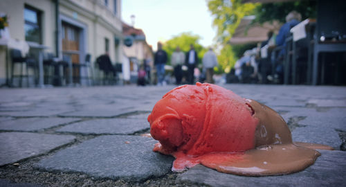 Close-up of fallen ice cream on street