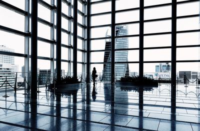 People walking in airport lobby