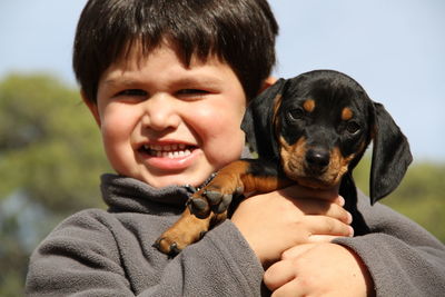 Portrait of cute boy with dog