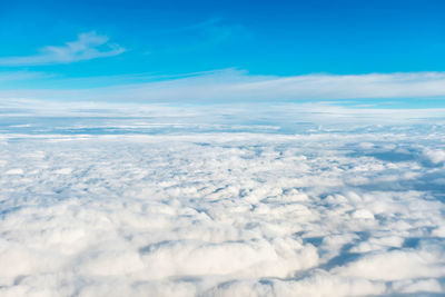 Aerial view of clouds over sea against sky